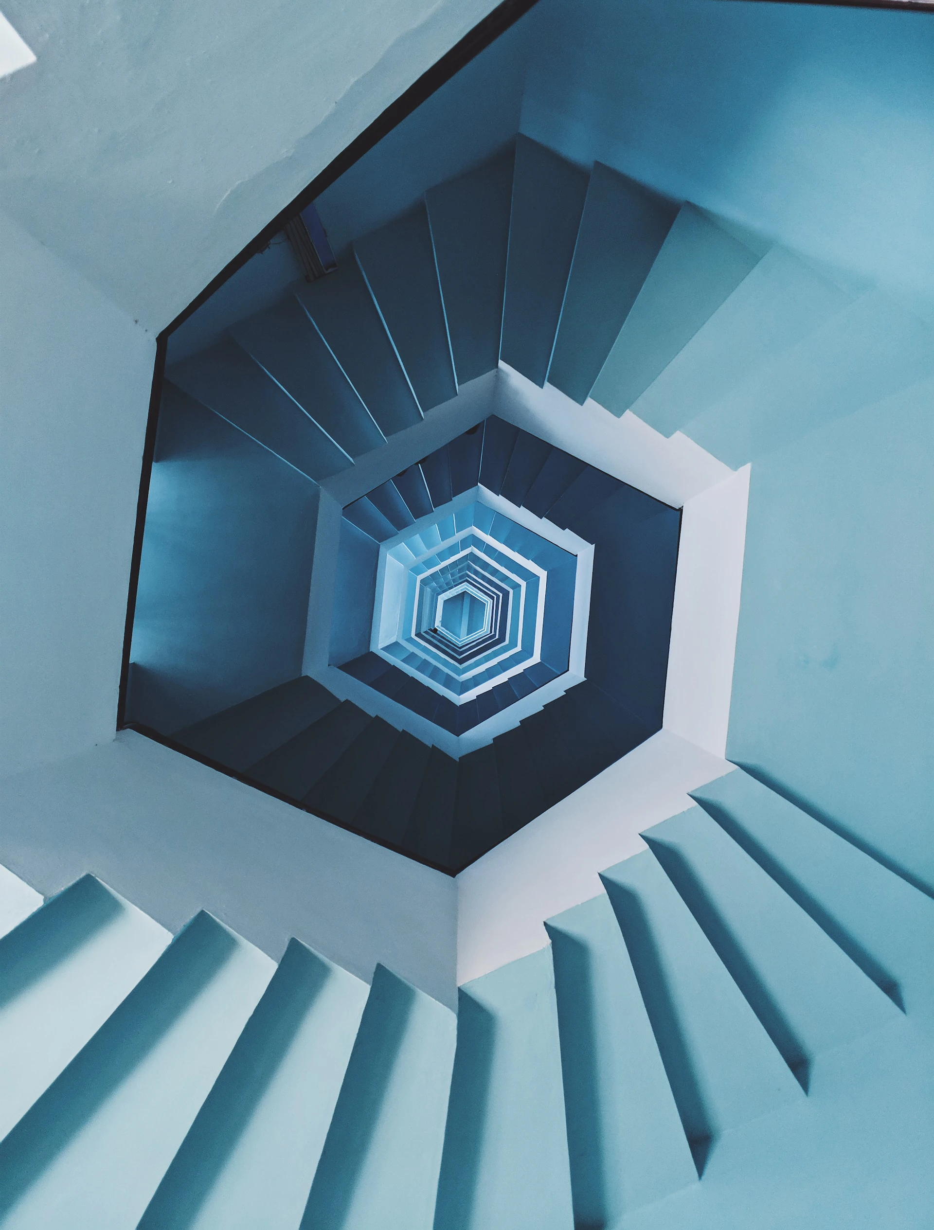 hexagonal descending staircase in blue looking from a birds eye view